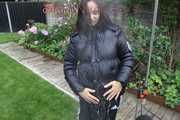 Watching Aiyana wearing a sexy black shiny nylon rainpant and a black shiny nylon down jacket trying the garden shower  (Pics)