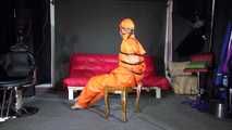 Sexy Pia wearing an oldschool orange shiny nylon rain pants and rain jacket being tied and gagged with belts and a ballgag on a chair (Video)