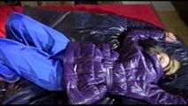 Sonja tied, gagged and hooded with cuffs on a bed wearing a sexy black blue pants and a purple down jacket (Video)