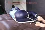 PIA tied with ropes on the sofa, gagged with a cloth gag wearing a sexy blue oldschool shiny nylon rain suit (Pics)