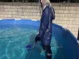 Watch Chloe cleaning the Pool in her shiny nylon Rainwear