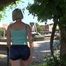 Watching SEXY SONJA walking through the city wearimg a blue shiny nylon shorts and tshirt (Video)