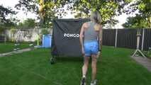 Watch Maly in her shiny nylon Shorts enjoying the warm Weather in the Garden