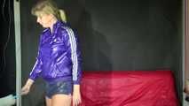 Watching sexy Pia wearing a supersexy shiny nylon shorts and rain jacket cleaning the studio (Video)