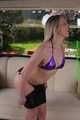 Sophie bound and gagged in a purple shiny wetlook Bikini