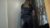 Watching sexy Sandra wearing a black shiny nylon jumpsuit doing her housework (Video)