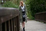 Miss Petra in a hot vinyl skirt, high heels and transparent blouse at photo shooting