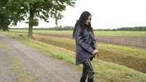 Miss Amira in blue Hunter rain jacket and patent leggings