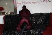 Watching Lucy wearing a supersexy purple/red downsuit preparing her sofa and lolling on it (Pics)