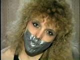 BEAUTIFUL DOE EYED REBECCA IS BALL-GAGGED, MOUTH STUFFED, TAPE GAGGED & BLINDFOLDED (D33-4)