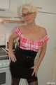 Blonde MILF Claudia strips in the kitchen