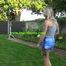 Watch Maly in her shiny nylon Shorts enjoying the warm Weather in the Garden