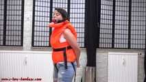 Handcuffed in life jacket