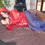 Jill tied, gagged and hooded with a pillory and cuffs wearing sexy shiny nylon rainwear (Pics)