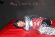 Sonja being tied, gagged and hooded with plastic wrap wearing a sexy shiny nylon rainwear combination (Pics)