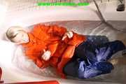 SEXY SONJA wearing a black shiny nylon rain pants and an orange big downjacket enjoying a bath (Pics)