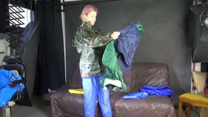 Watching sexy Pia wearing putting on several layers of sexy shiny nylon rainwear (Video)