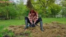 Rubber boot mistress presses slave face into manure