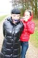 Beautiful archive girl tied and gagged outdoor by another one both wearing a shiny downjacket (Pics)