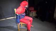 Sandra wearing a sexy OLDSCHOOL shiny nylon downsuit sitting on a chair being tied, gagged and hooded with tension belts and a clothgag (Video)