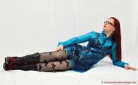 Nadja shows her short black pvc dress under a blue raincoat