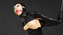 Gagged rubber doll in monogloves