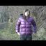 Alina wearing a jeans over a sexy shiny nylon shorts and a purple down jacket strolling on a lake (Video)