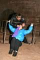 One archive girl tied and gagged by another archive girl outdoor wearing lightblue and black shiny downjackets (Pics)