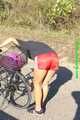 Watch Sandra riding her bike enjoying her red shiny nylon Shorts