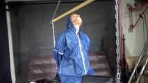 Watch Sandra bound gagged and wearing her shiny nylon Rainwear