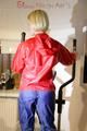 Sonja wearing a sexy red/blue rainwear combination during her workout (Pics)