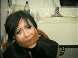 30 YR OLD ASIAN LI-JUN IS CLEAVE GAGGED, TIED TO CHAIR, LOTS OF WIDE EYED GAG TALKING (D52-11)