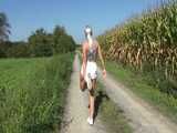 Watch Chloe taking a walk with her shiny nylon Shorts