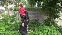 Watching sexy Sandra wearing sexy shiny nylon rainwear gardening outside (Video)