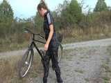 Watch Sandra riding her bike enjoying her shiny nylon Jumpsuit