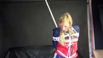 SANDRA being tied and gagged overhead with ropes and a clothgag wearing a sexy oldschool shiny nylon shorts and a rainjacket (Video)