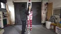 Ayana in a shiny nylon red rainsuit and a see through PVC Rainjacket, tied gagged, hooded and vibed