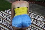 Sexy Sonja wearing a lightblue shiny nylon shorts with a yellow top durig her bath in the sun (Pics)