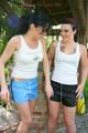 Jill and her friend having fun together outdoor both wearing shiny nylon shorts and a top (Pics)