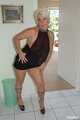 Blonde mature Claudia stipping out of a black dress