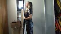 Watching sexy Sandra wearing a black shiny nylon jumpsuit doing her housework (Video)