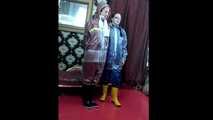 Lady Nadja and Miss Scarlett in  AGU rainwear covered with transparent raingear (video)