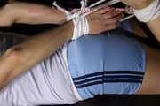 Sandra being tied and gagged with ropes and a clothgag on a sofa wearing an oldschool lighblue shiny nylon shorts and a top (Pics)
