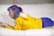 SEXY MARA lounging on the sofa wearing a sexy blue/yellow shiny nylon shorts and a yellow shiny nylon rain jacket (Pics)