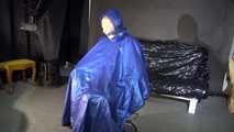 Watching sexy Sandra wearing a sexy blue shiny nylon rainpants and a blue down jacket being tied and gagged and hooded with ropes on a hairdressers chair covered with a rain cape (Video)