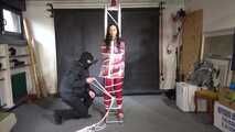 Ayana in a shiny nylon red rainsuit and a see through PVC Rainjacket, tied gagged, hooded and vibed