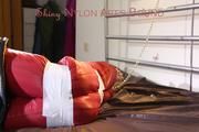 Mara tied, gagged and hooded with tape on bed wearing crazy sensation downwear in red/black (Pics)