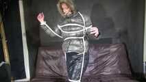 Watch Pia beeing bound and gagged in her shiny nylon Downwear