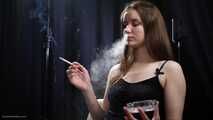 18 aged girl is smoking two 100mm Reds with a lot a nose exhales