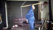 Watch Sandra bound gagged and wearing her shiny nylon Rainwear